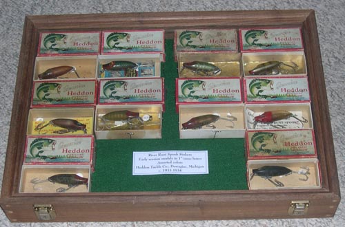 Assorted Fishing Lures In Display Cases.
